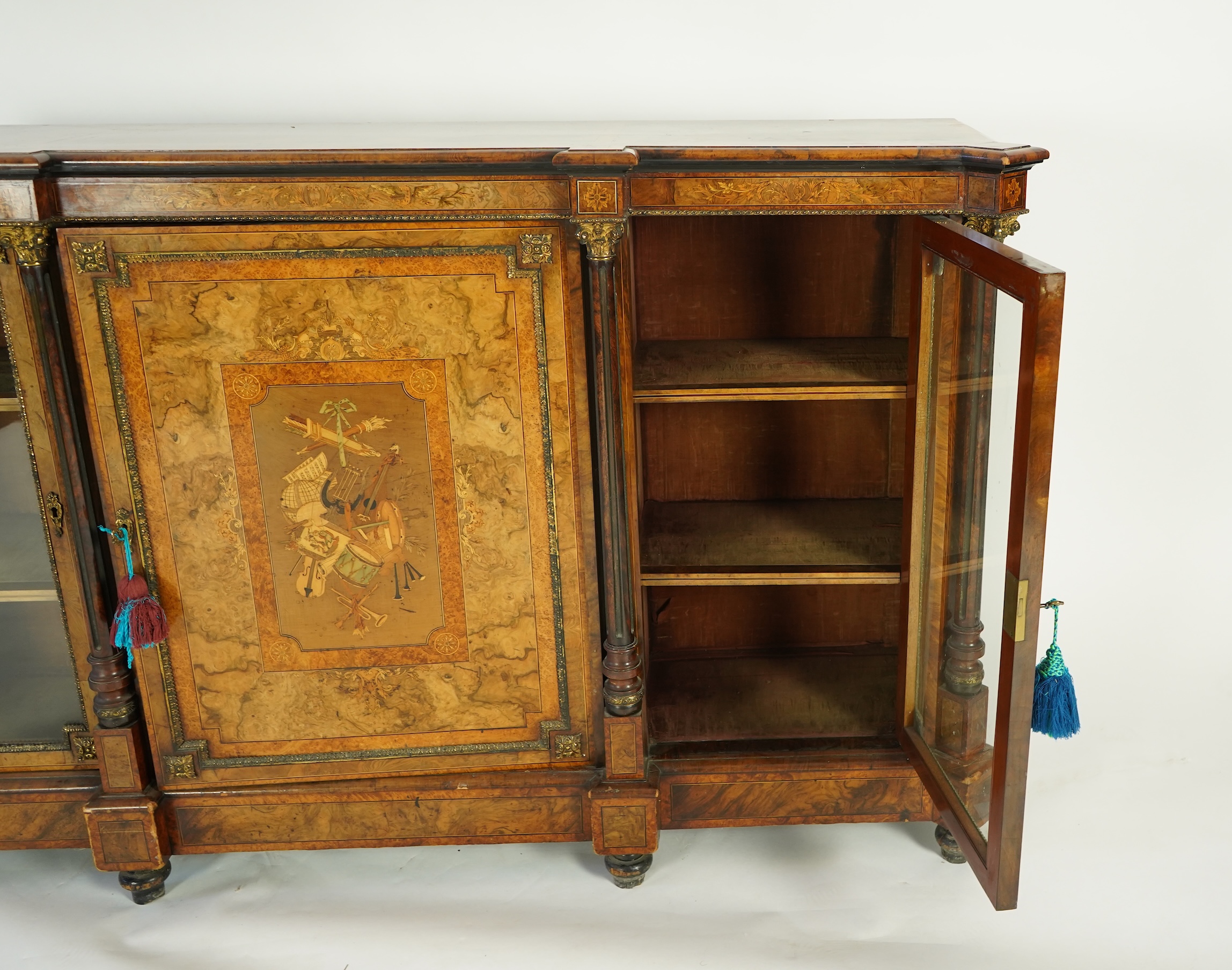 A Victorian birds eye maple banded, gilt metal mounted figured walnut side cabinet